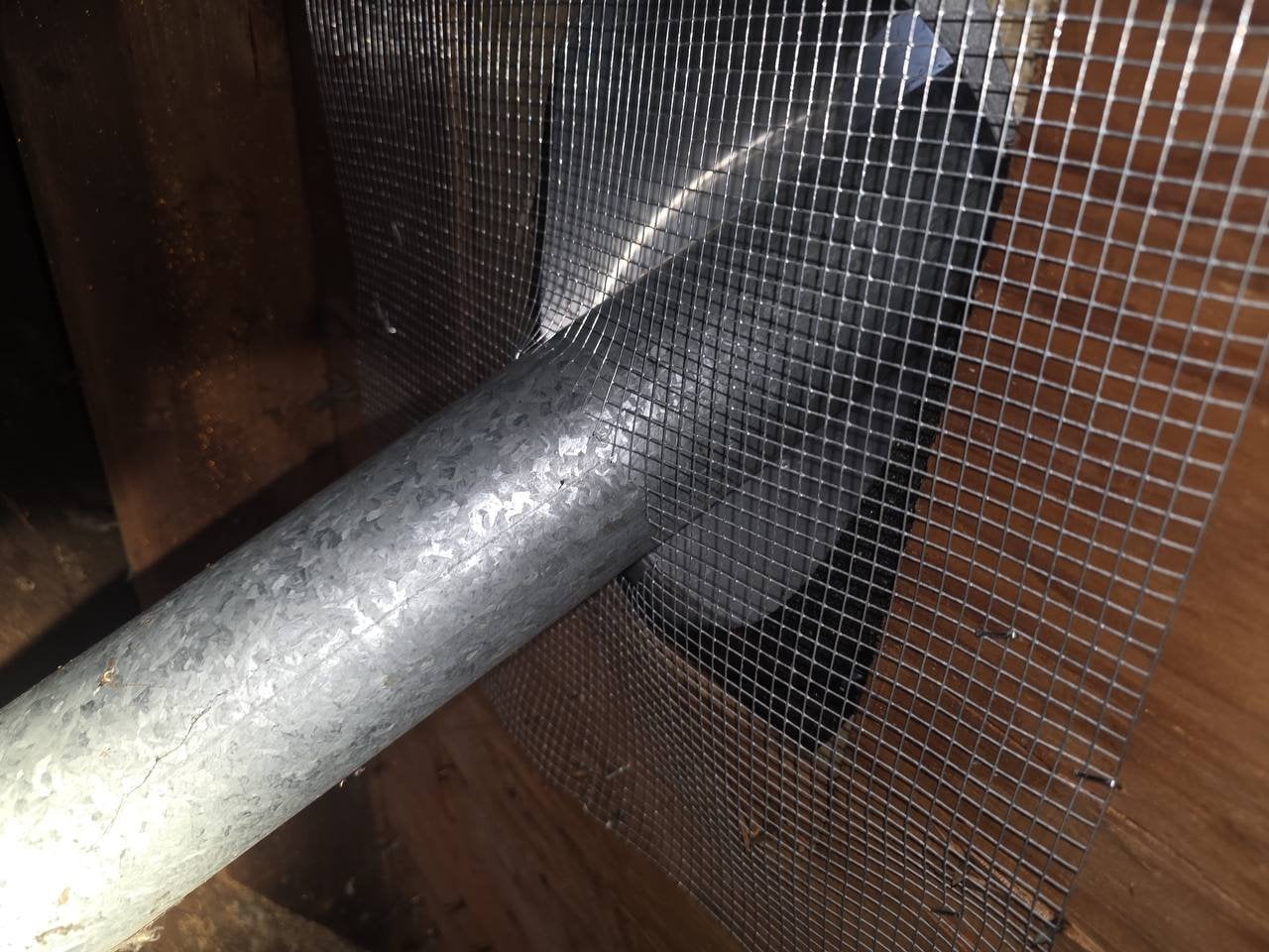 Wire mesh sealed around a duct penetration in Santa Rosa
