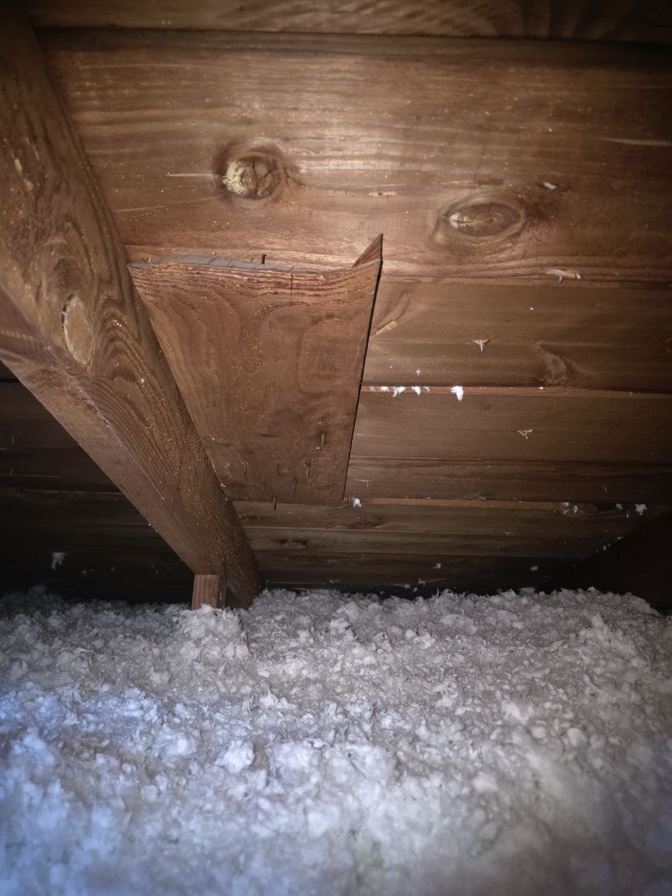 New blown-in insulation between attic framing in South San Francisco
