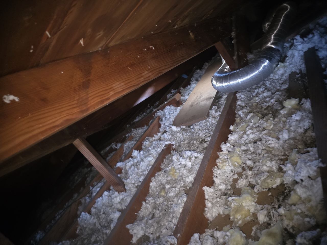 South San Francisco attic before work, old insulation and debris