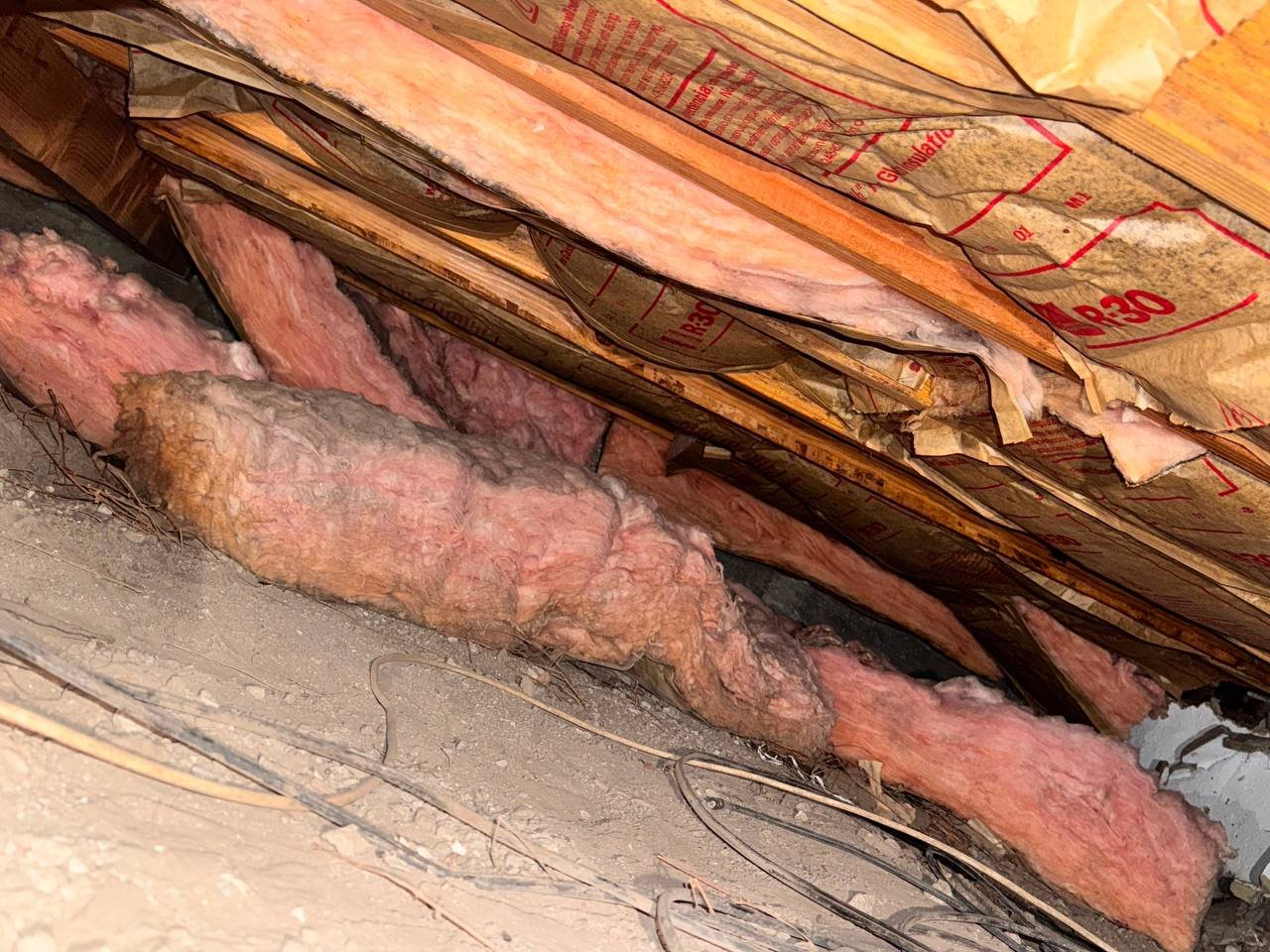 Old insulation lying on the crawl space soil in Sunnyvale before work