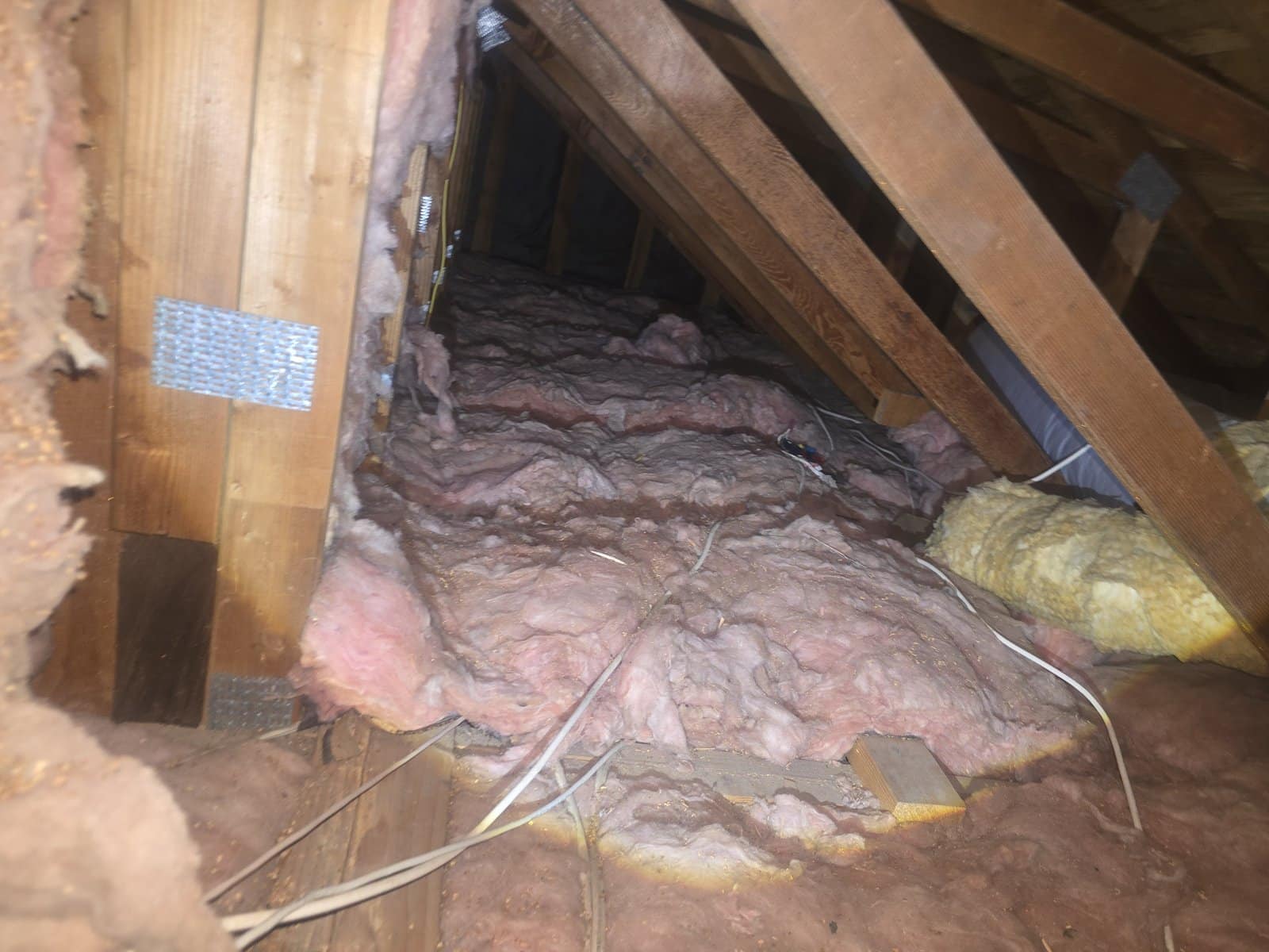 Another area of old insulation in the Thousand Oaks attic before work