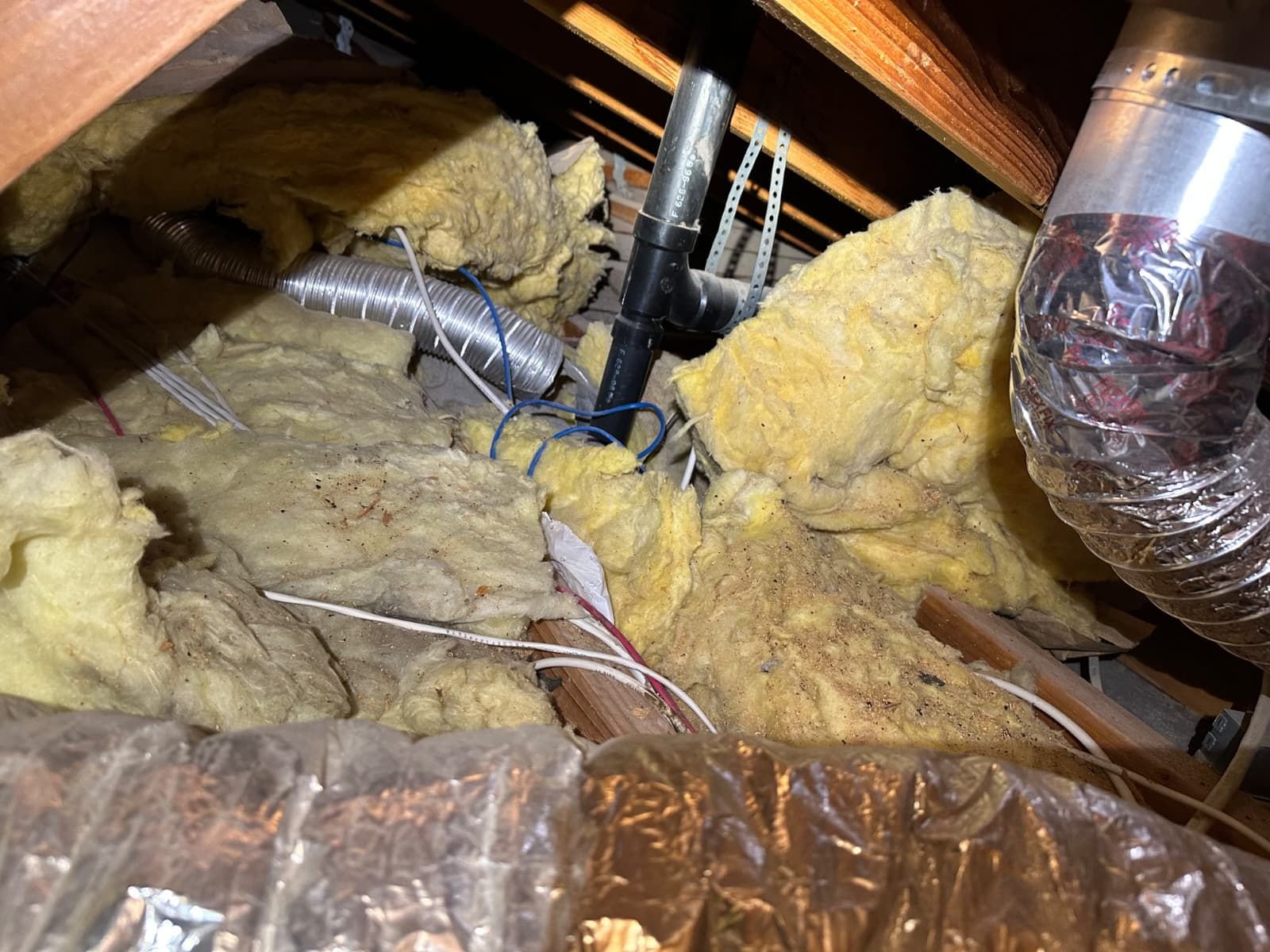 Torrance attic before work, old insulation
