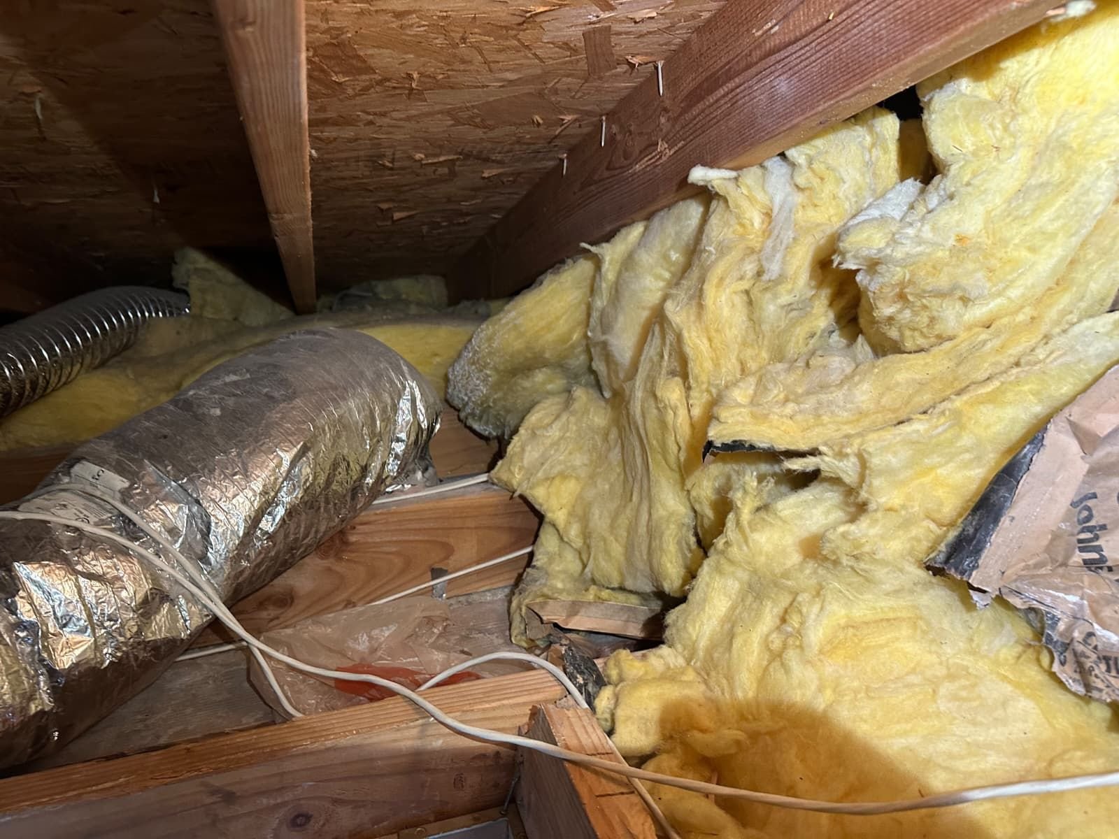 Another area of old insulation in the Torrance attic before work