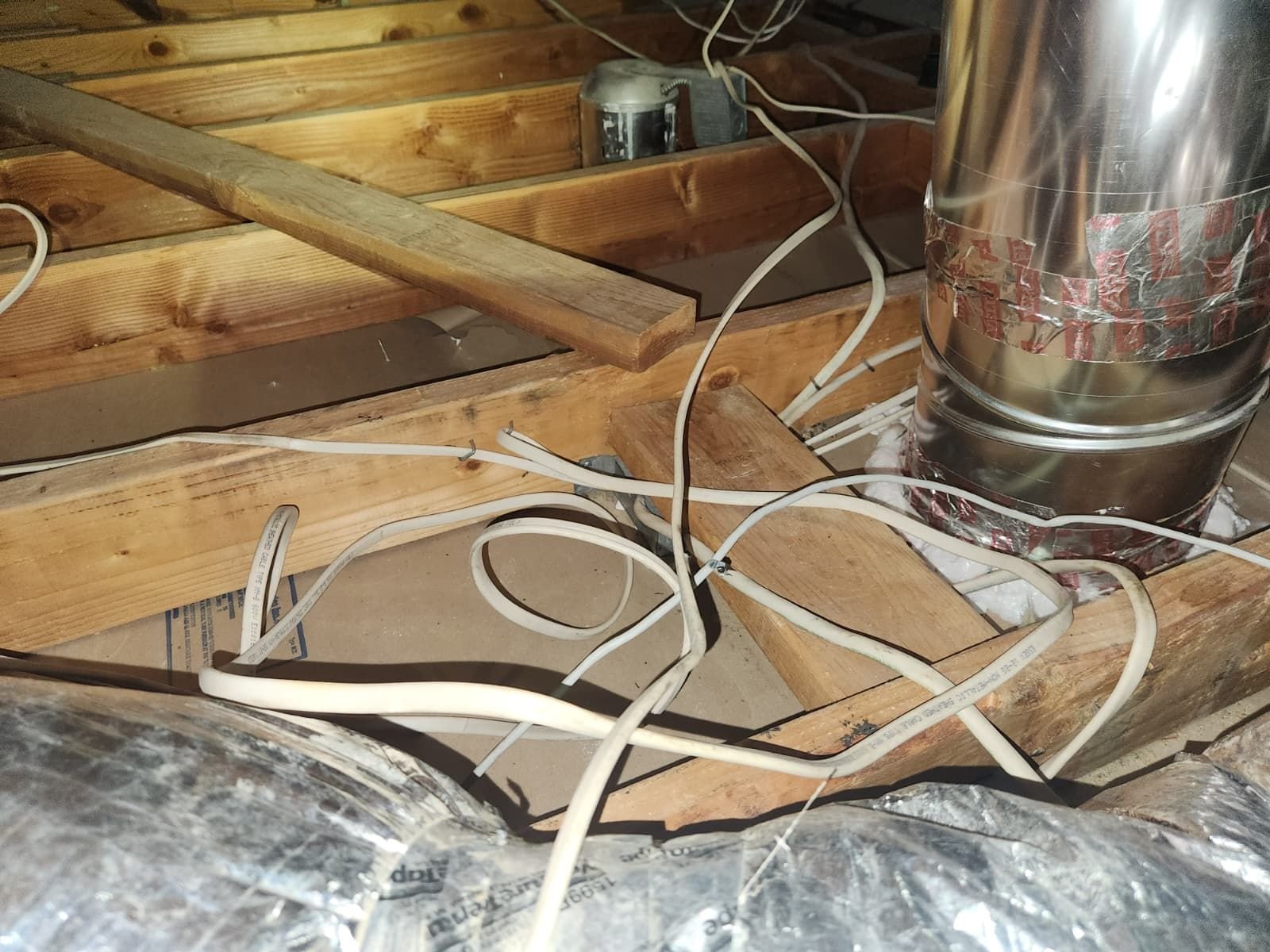 Cleaned attic deck around a flue pipe in Torrance