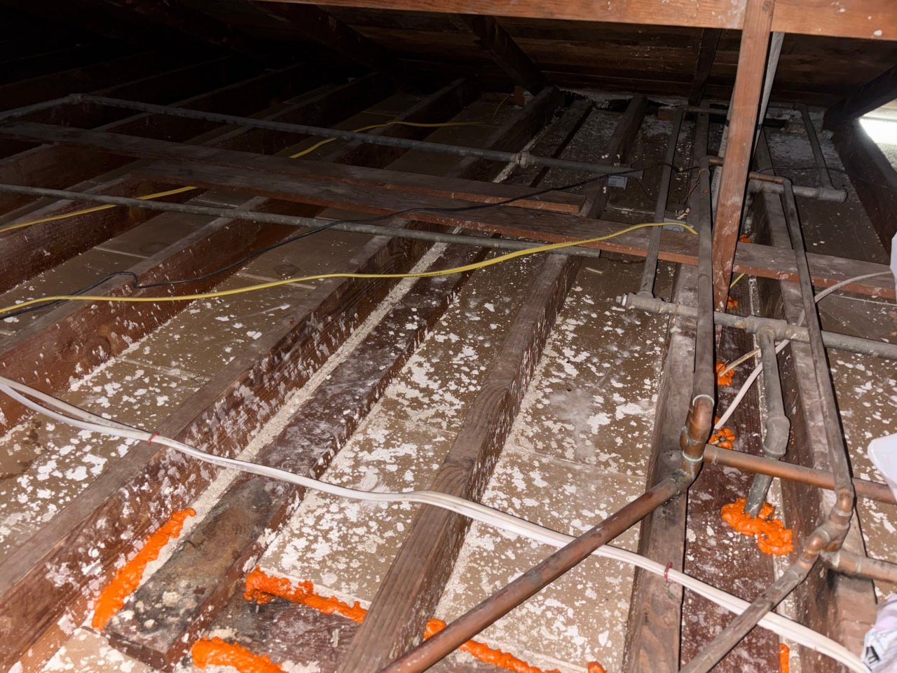 Foam air sealing around an attic penetration in Torrance