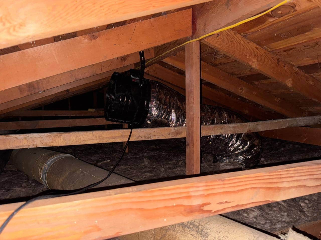 Attic fan and new insulation in a Tracy attic