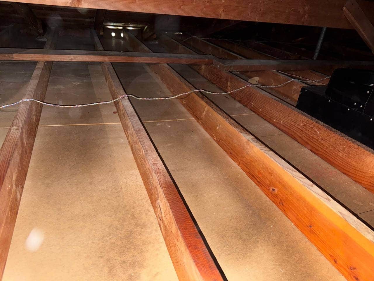 Tracy attic after removal, joists and deck cleaned