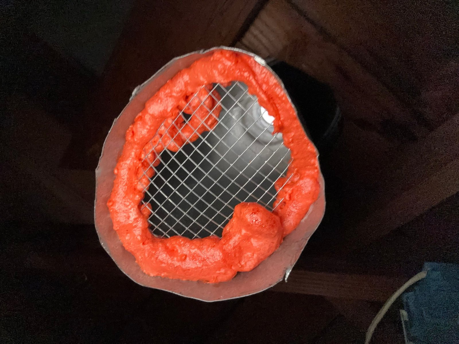 Pipe opening closed with wire mesh and foam in a Upland attic