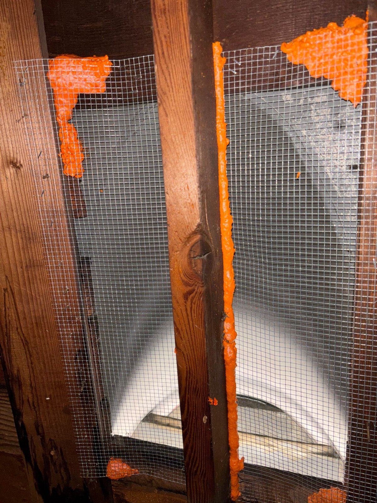 Attic vent sealed with wire mesh and foam in Upland