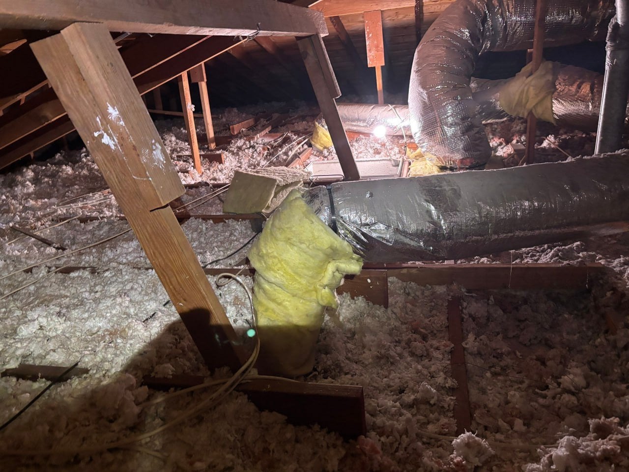 Another area of old insulation in the Westlake Village attic before work