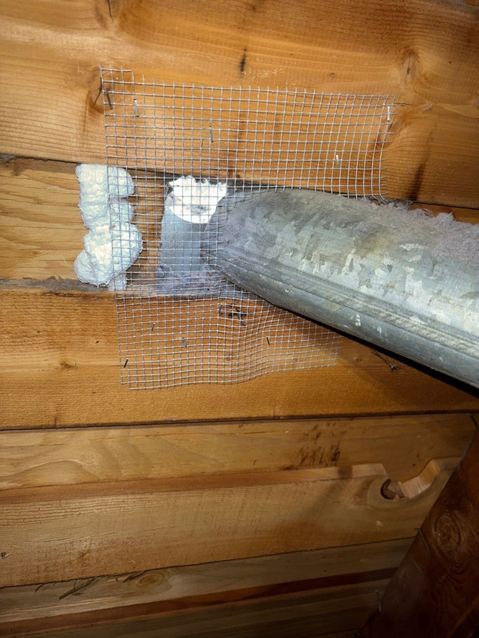 Wire mesh sealed around a duct penetration in Westlake Village